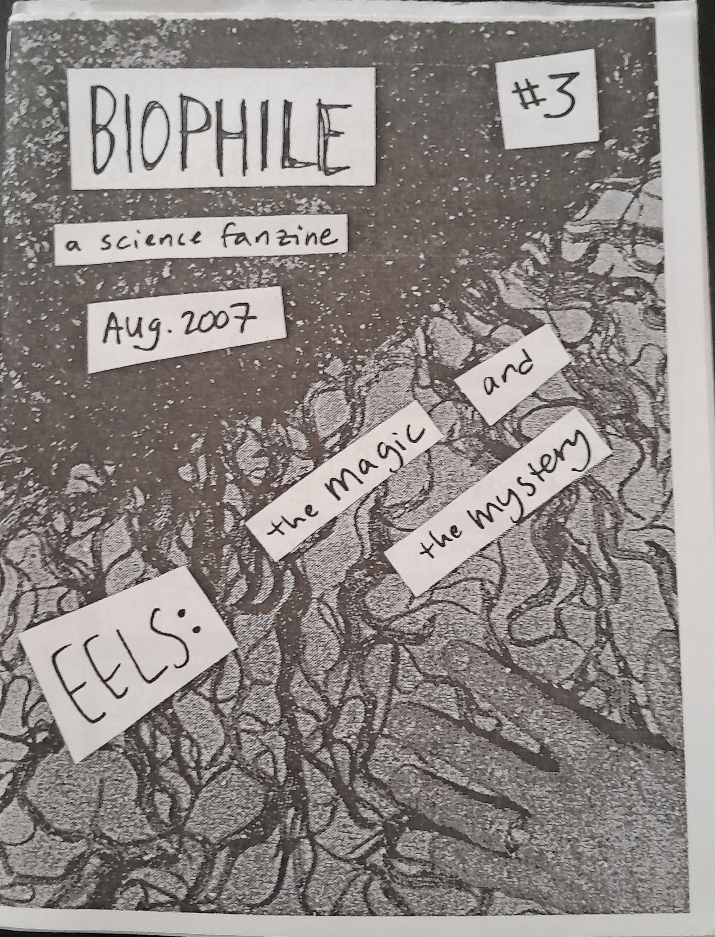A black and white cover showing a human hand on top of an ink print of a nest of eels. It includes the title, "Biophile", the subtitle, "a science fanzine", the issue number, #3, the date of print, August 2007, and the subject of the issue: "Eels: the magic and the mystery"