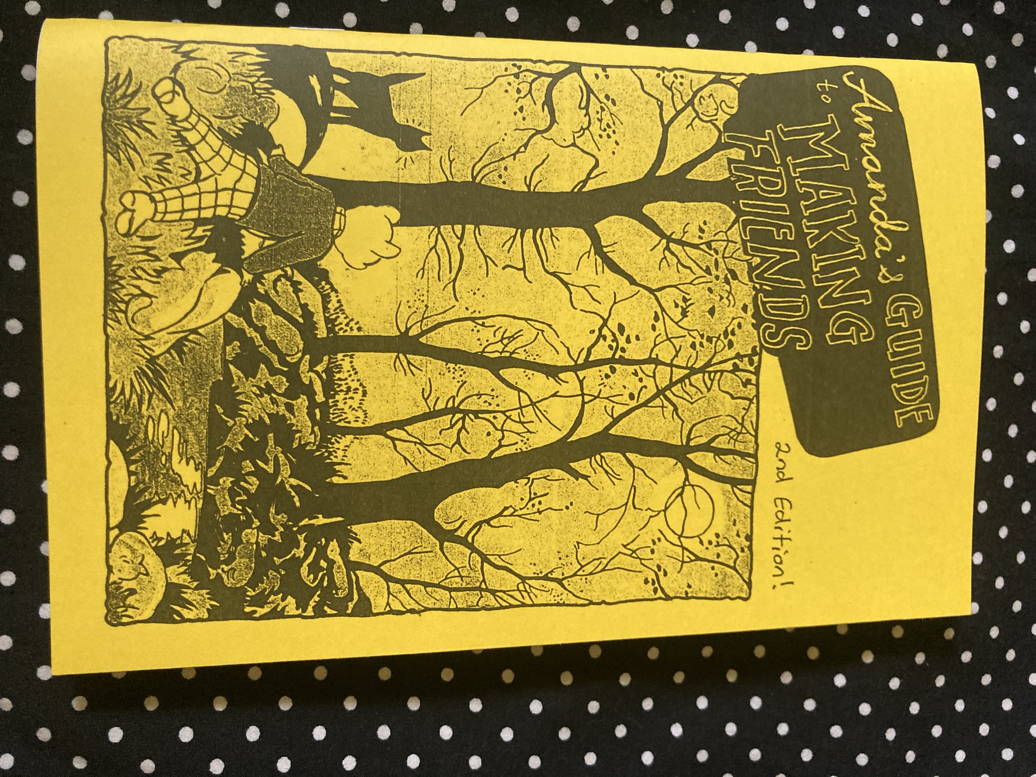 Cover of the zine, which shows an anthropomorphized bear looking out at a forest, with cats around it.