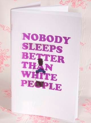 Purple text reading "Nobody Sleeps Better Than White People" printed on a sheer plastic cover, revealing a silliouhette underneath.