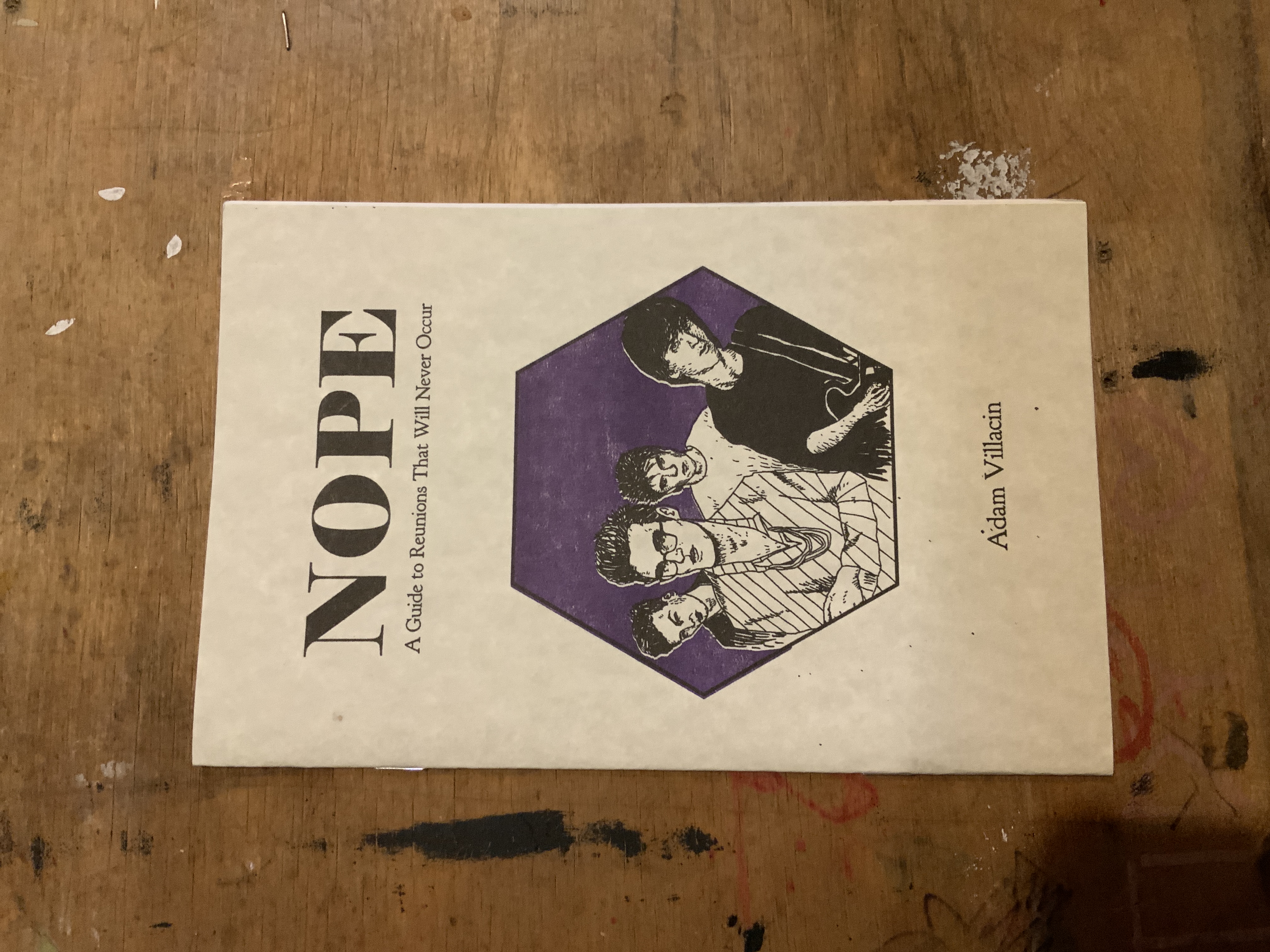 A zine cover with title on top, the author's name at the bottom, and an illustration of The Smiths on a purple background in the center.