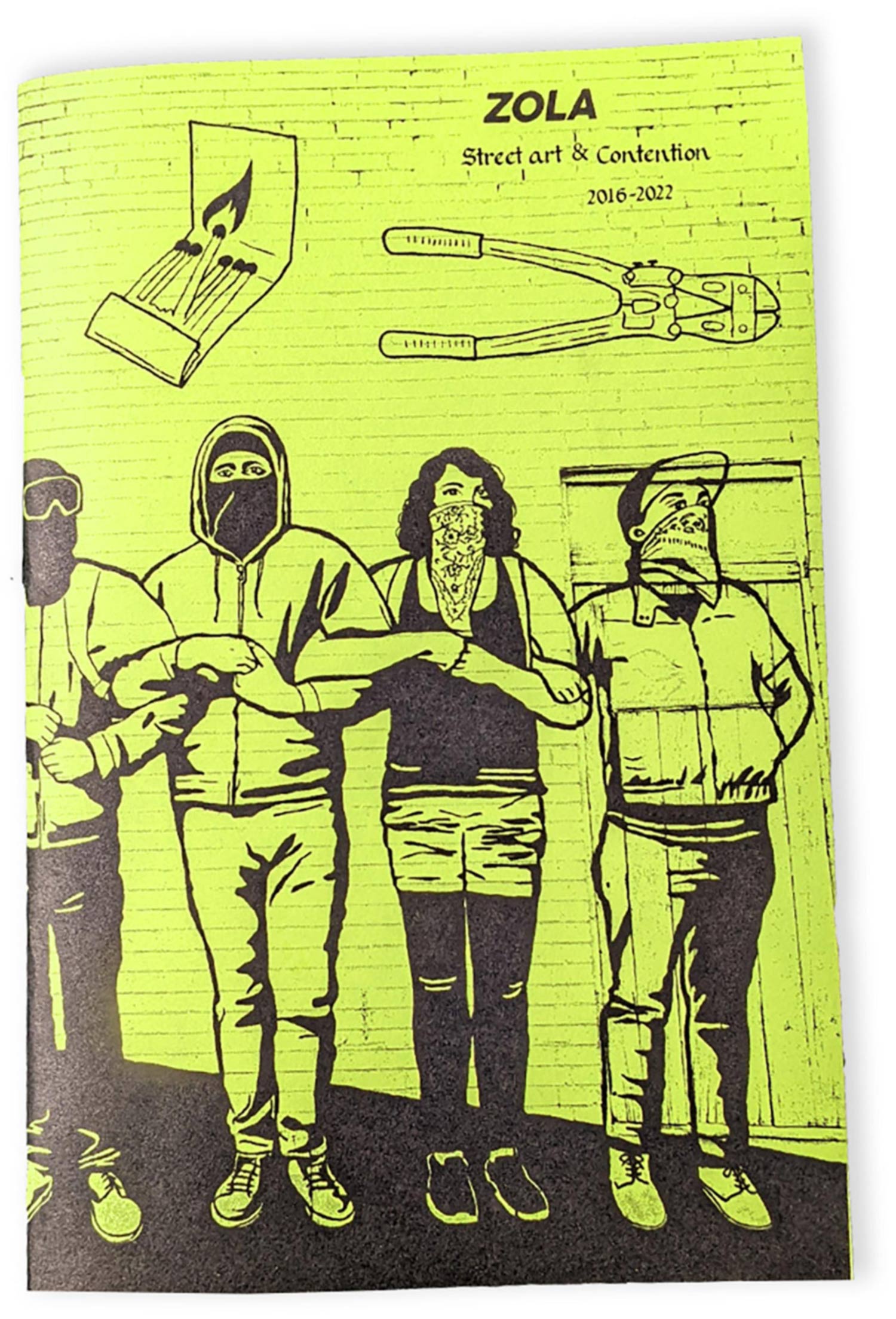 Cover of the zine is yellow and shows an illustration of 4 people with linked arms wearing bandannas and street clothes, plus a matchbook and pliers