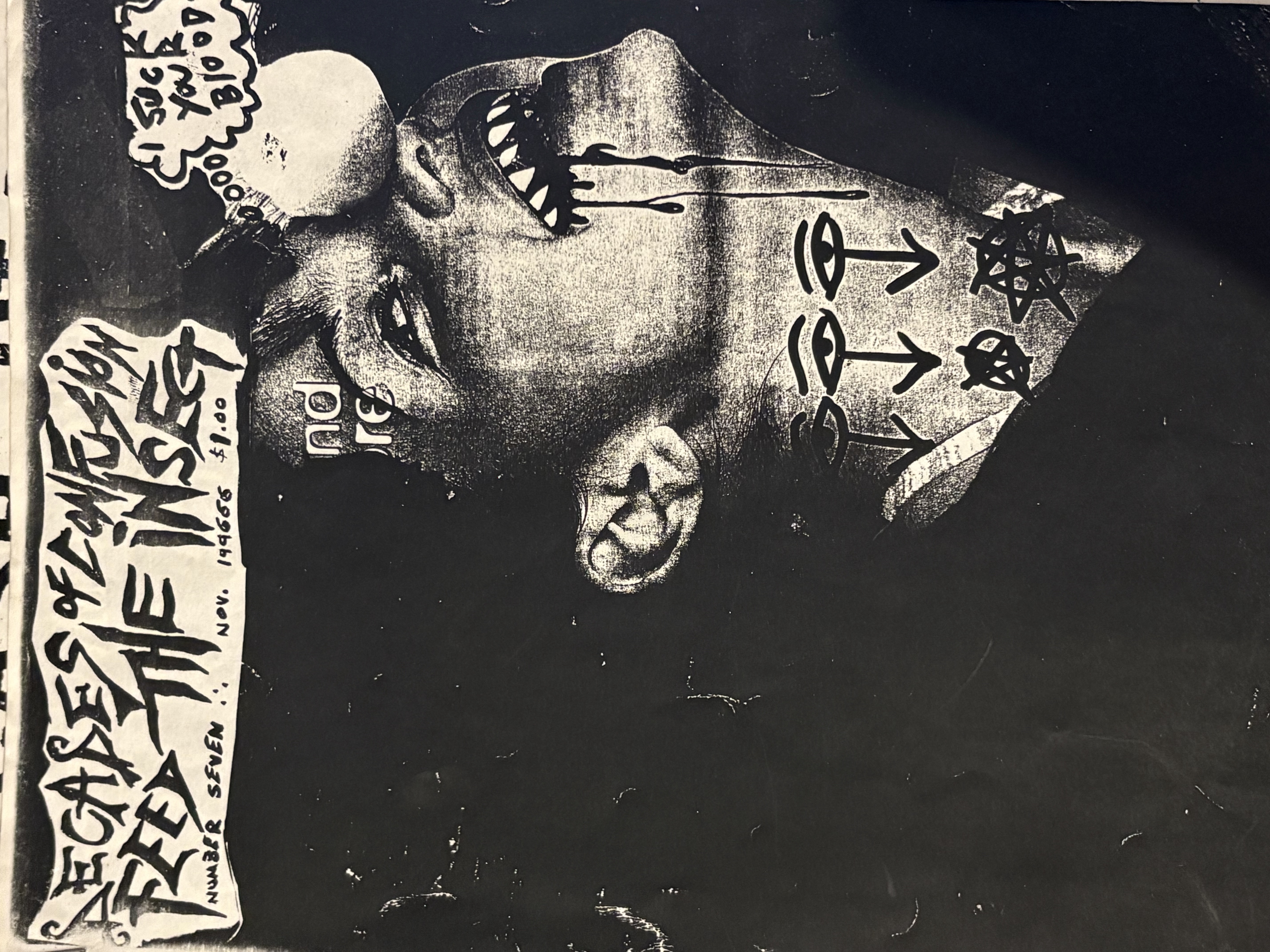 Cover text, full page, “I suck your blood” in thought bubble above black and white image of child with fake sharp teeth, dripping blood, tattoos. 